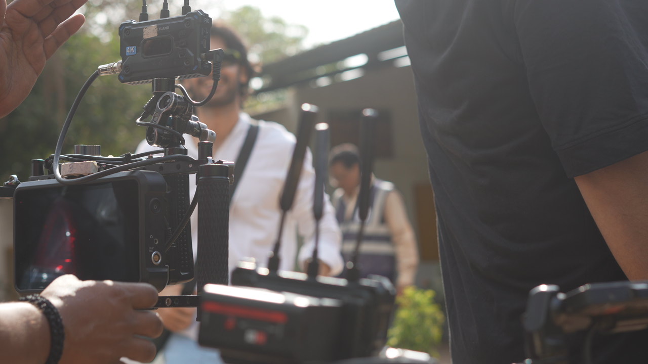 Cinematography crew operating camera rig on set