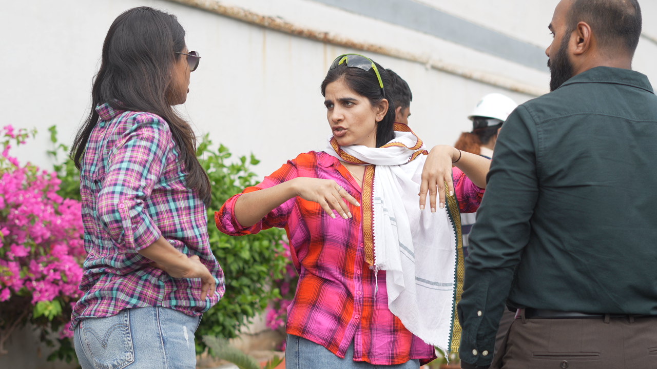 Director guiding talent during an outdoor shoot