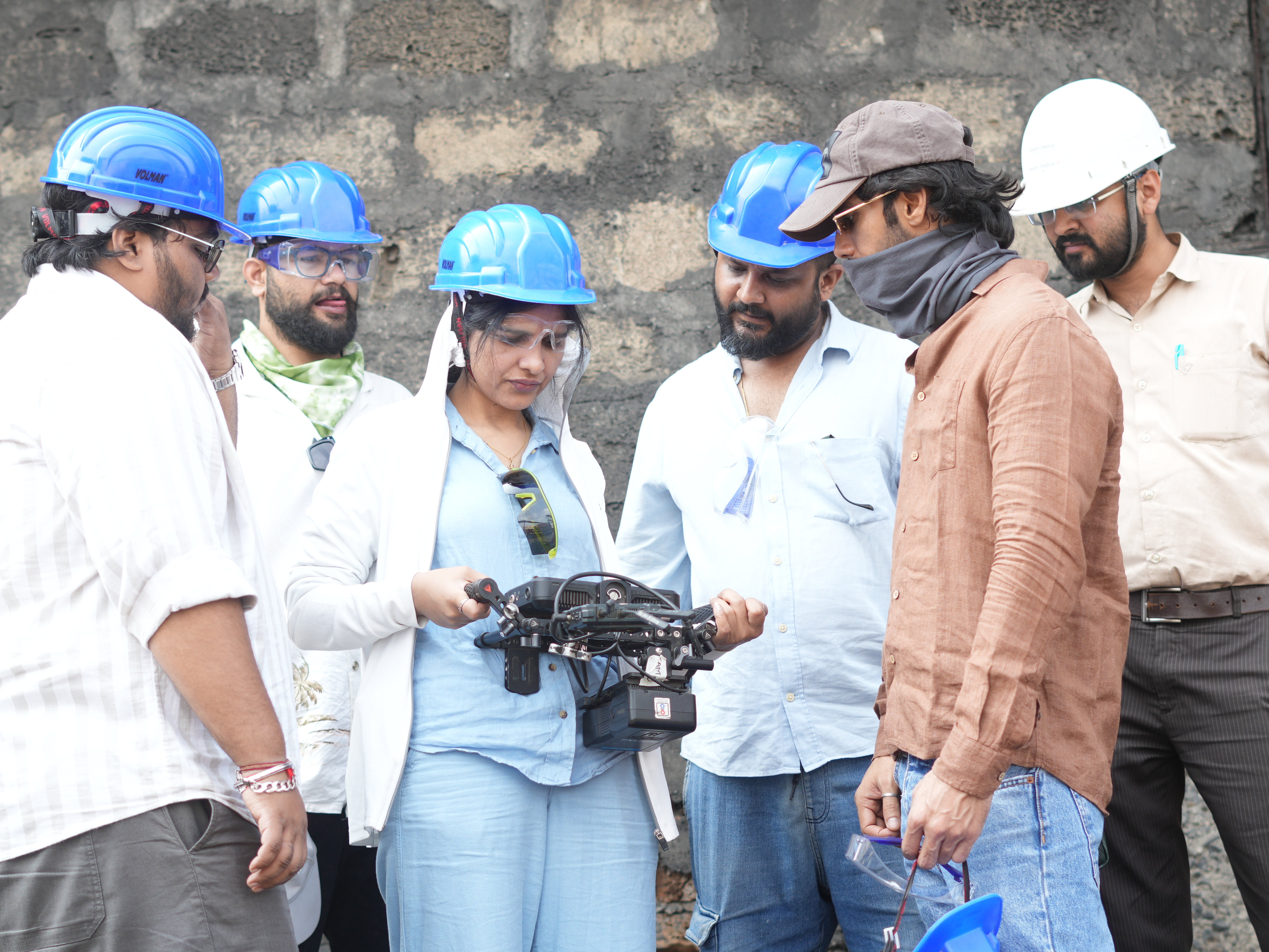 GHCL film crew collaborating on set with professional camera equipment